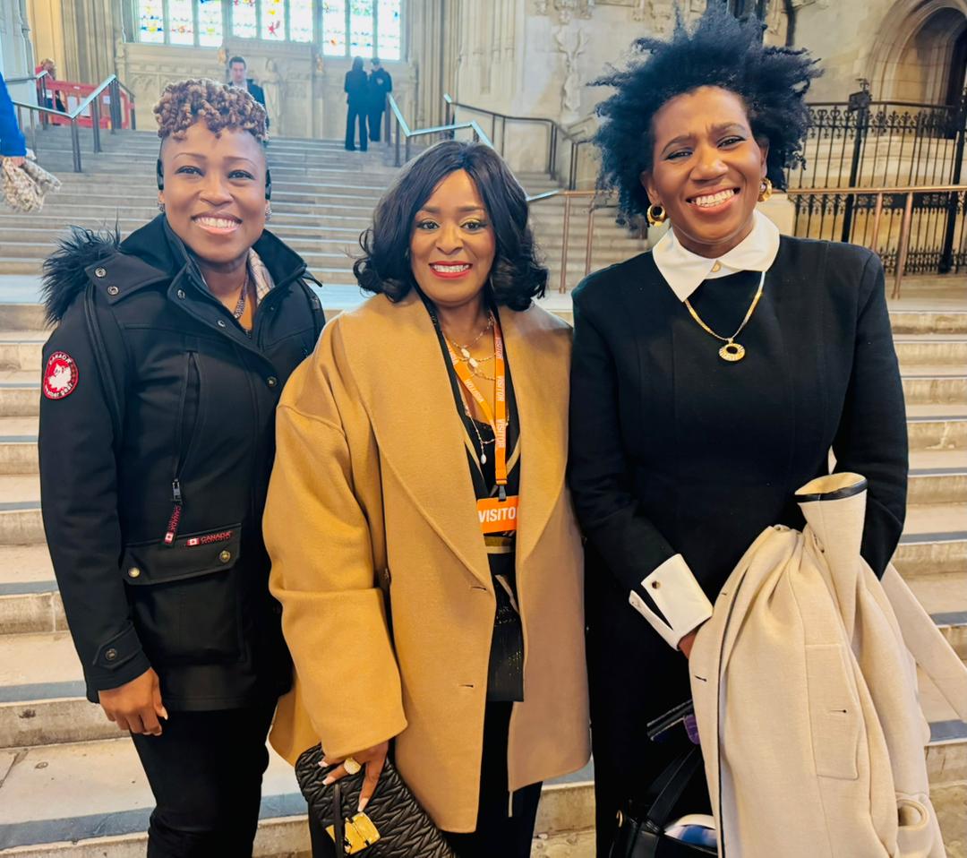 Three Azu-Eri advocates together at a public building