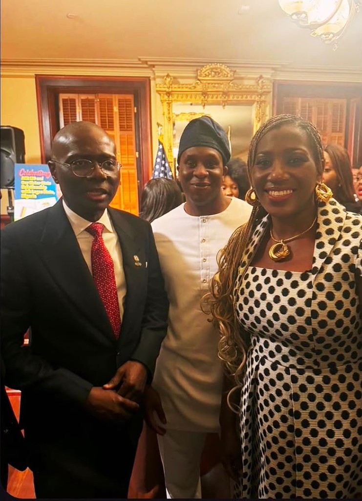 Three guests at the California–Lagos Business and Investment Summit, standing together in a formal room